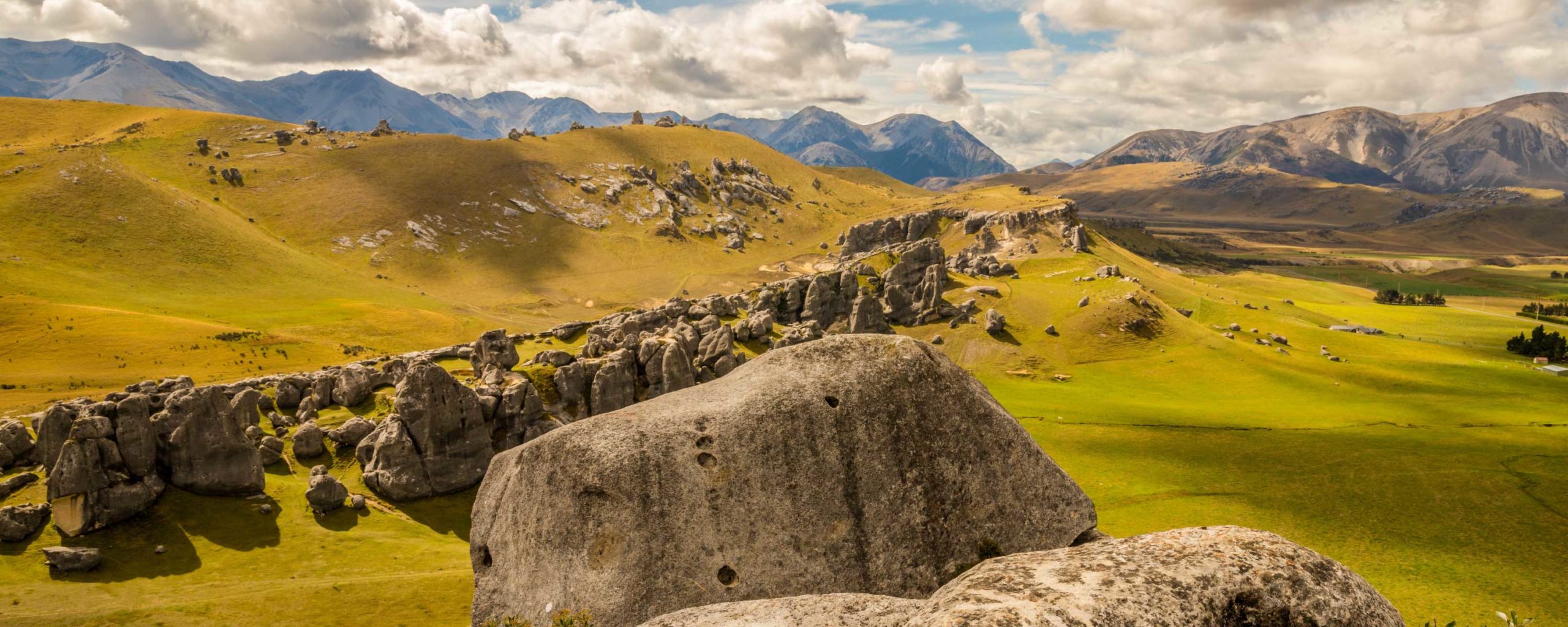 odd shaped rocks in a hilly field